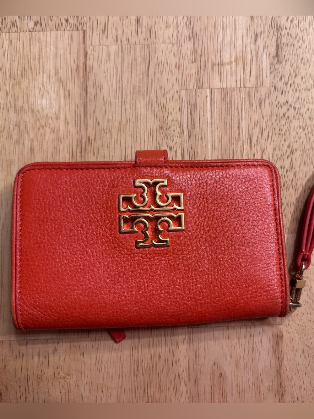 Tory Burch bright orang/red pebbled leather wristlet wallet with gold logo